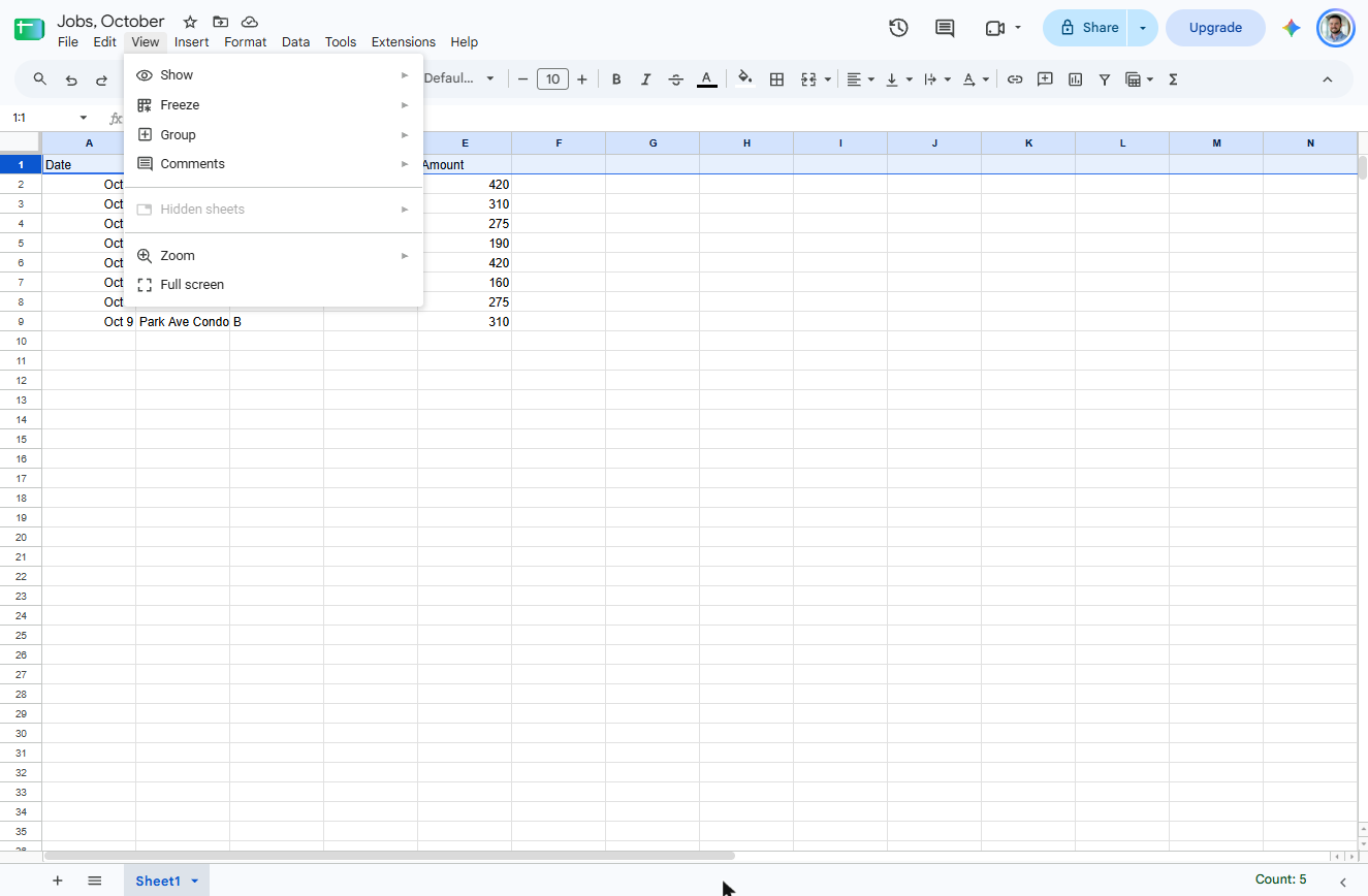 Google Sheets View menu open with Show, Freeze, Group, Comments and Zoom