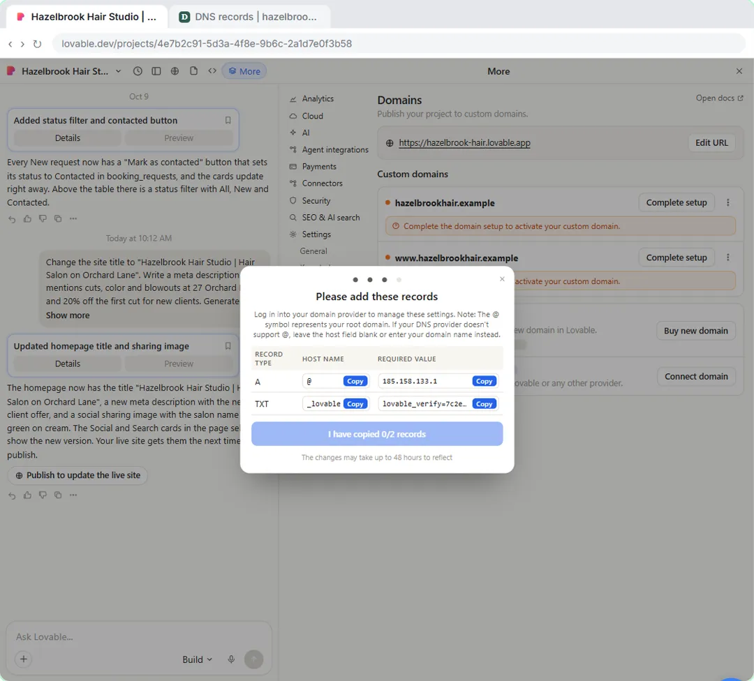 Lovable dialog listing the A record and TXT verification record to add at the domain provider
